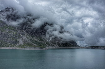 Misty Mountain Lake Landscape with Dramatic Clouds