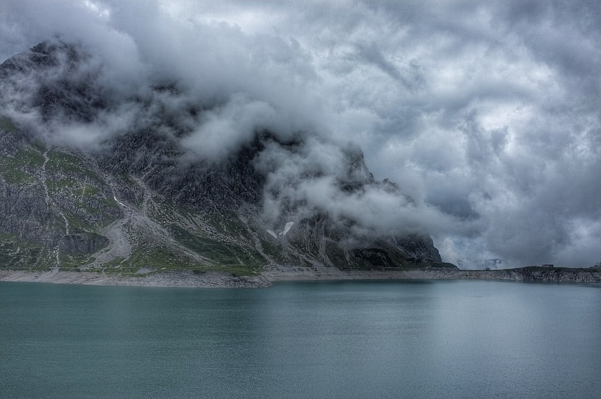 Misty Mountain Lake Landscape with Dramatic Clouds