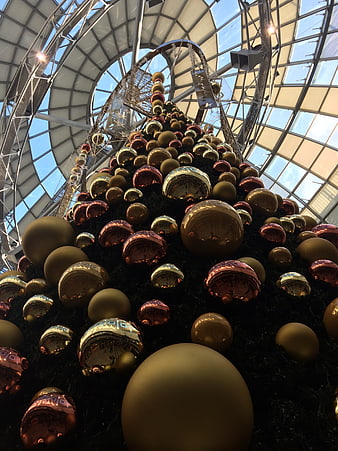 Low-Angle View of Large Christmas Tree with Gold and Red Ornaments