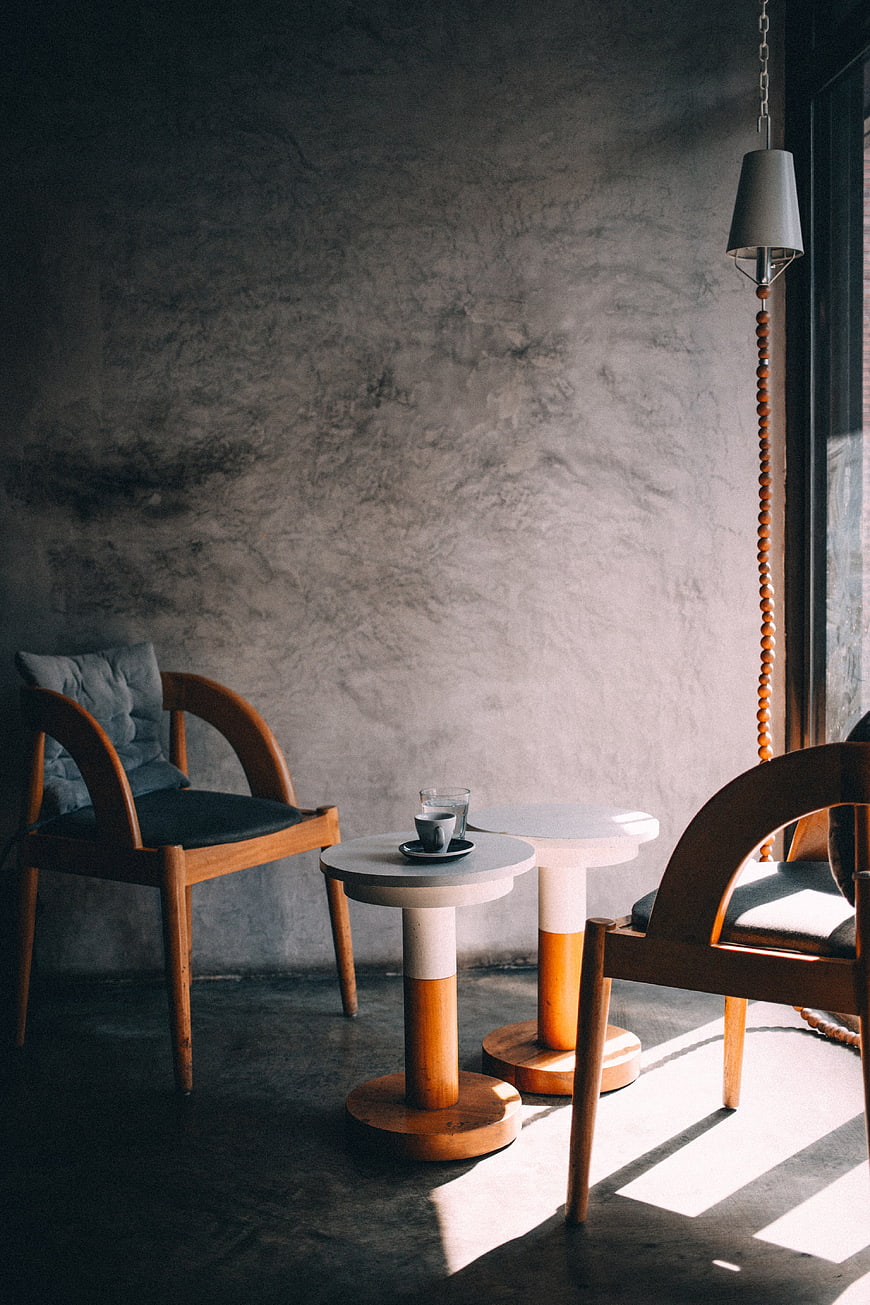 Minimalist Interior with Wooden Chairs and Concrete Wall