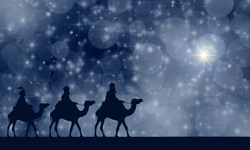 Silhouette of Three Wise Men on Camels Under Starry Night Sky