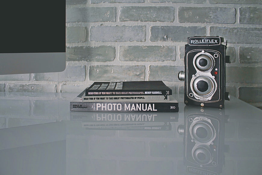 Vintage Rolleiflex Camera and Photography Books on Desk