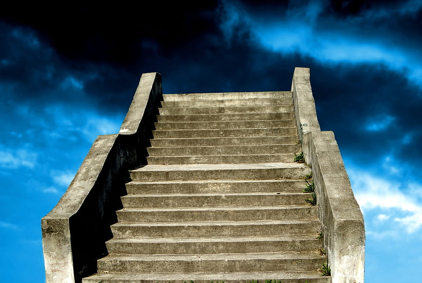 Concrete Stairs Leading Up to Dramatic Blue Sky