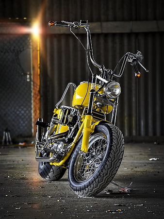 Custom Yellow Chopper Motorcycle Parked In Industrial Warehouse