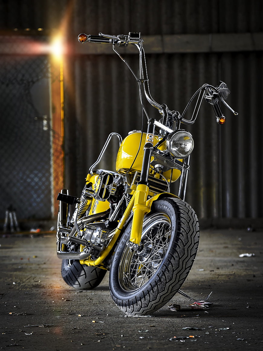 Custom Yellow Chopper Motorcycle Parked In Industrial Warehouse