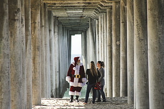 Santa Claus Meeting Women Under Concrete Pier