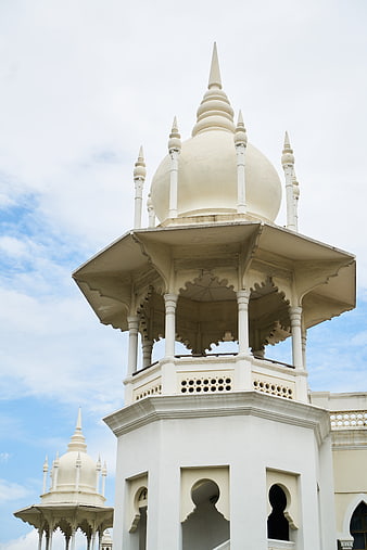 White Islamic Architecture Dome Against Blue Sky