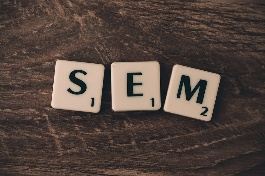 SEM Scrabble Tiles on Dark Wood Background
