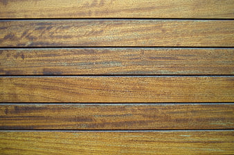 Close-up texture of weathered brown wooden deck planks