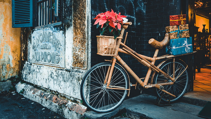 Bamboo Bicycle with Poinsettia and Gifts on Street