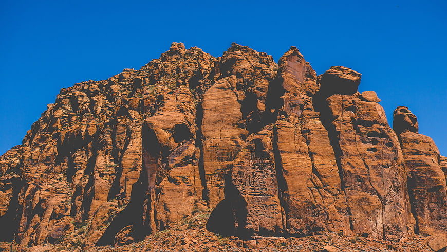 Red Rock Mountain Peak Against Blue Sky