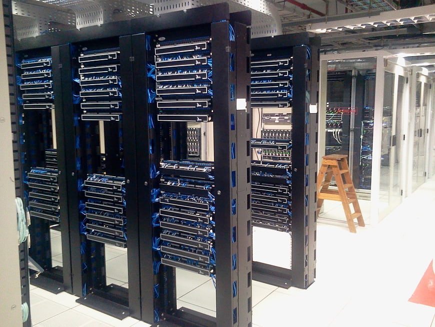Server Racks In Data Center With Blue Cabling