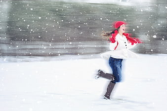 Joyful Woman Running in Snowy Winter Landscape