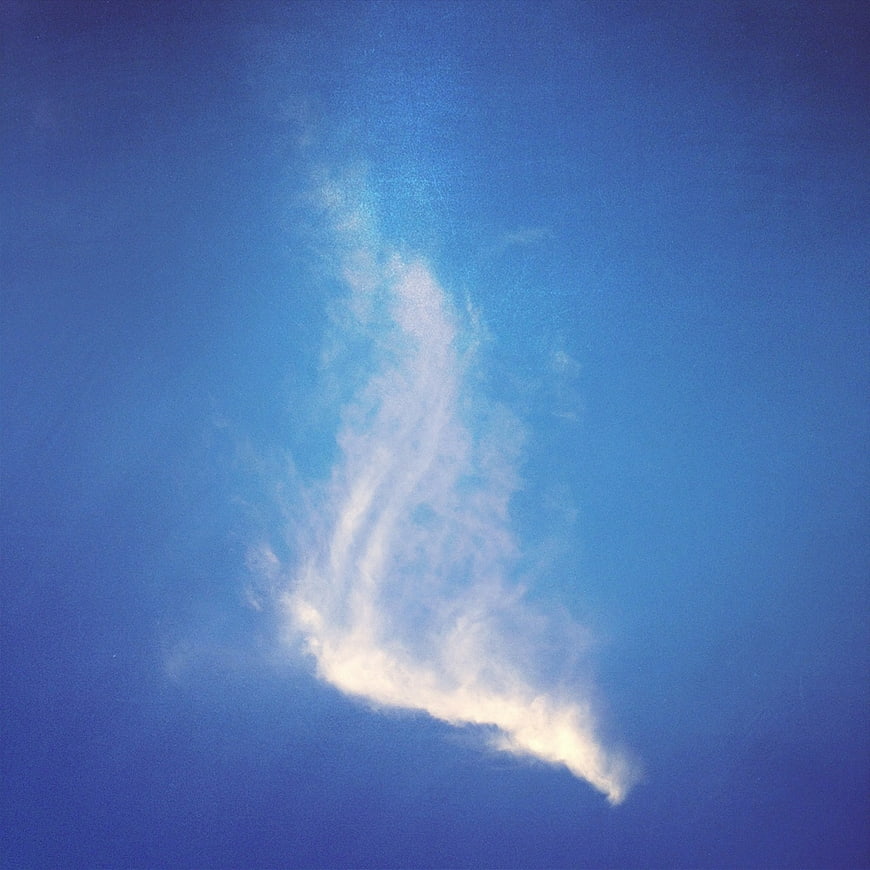 White Wispy Cloud in Blue Sky