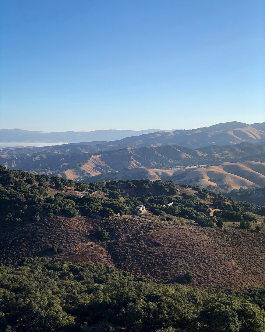 Scenic View of Rolling Hills and Blue Sky