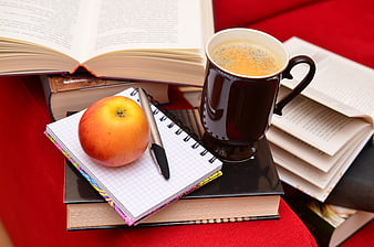Cozy Study Scene With Coffee, Apple, Notebook, And Books