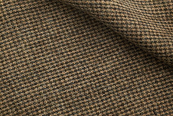 Close-up of brown and black tweed fabric texture