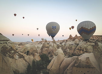 Hot Air Balloons Flying Over Cappadocia Rock Formations