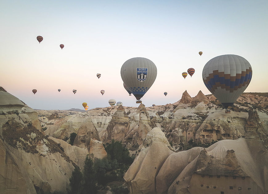 Hot Air Balloons Flying Over Cappadocia Rock Formations