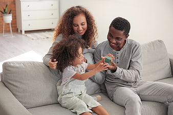 Happy African American Family Playing with Blocks on Sofa
