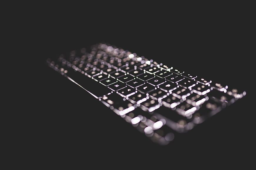 Blurred Computer Keyboard on Dark Background