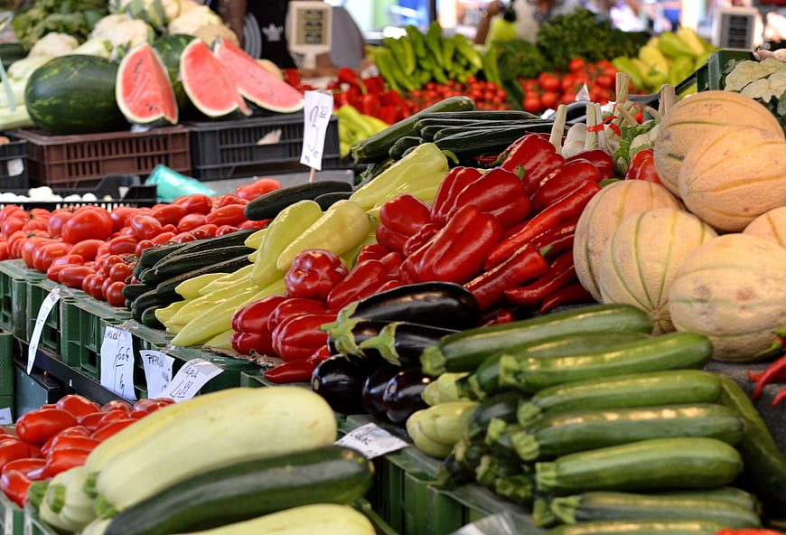 Colorful Fresh Vegetables And Melons At Outdoor Farmers Market Stand
