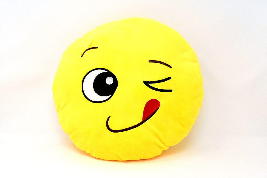 Yellow Winking Emoji Plush Pillow on White Background