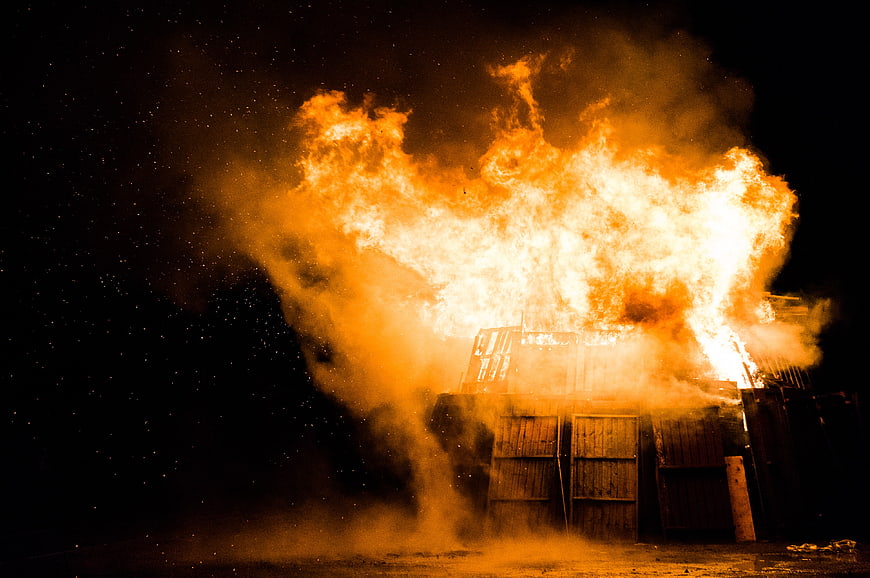 Dramatic Nighttime Building Fire with Intense Flames and Smoke