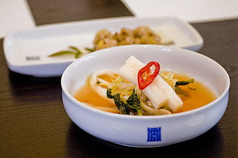 Korean Radish Kimchi Soup in White Ceramic Bowl