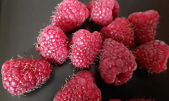 Fresh Red Raspberries on Dark Background