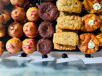 Assorted bakery pastries and cakes in a display case