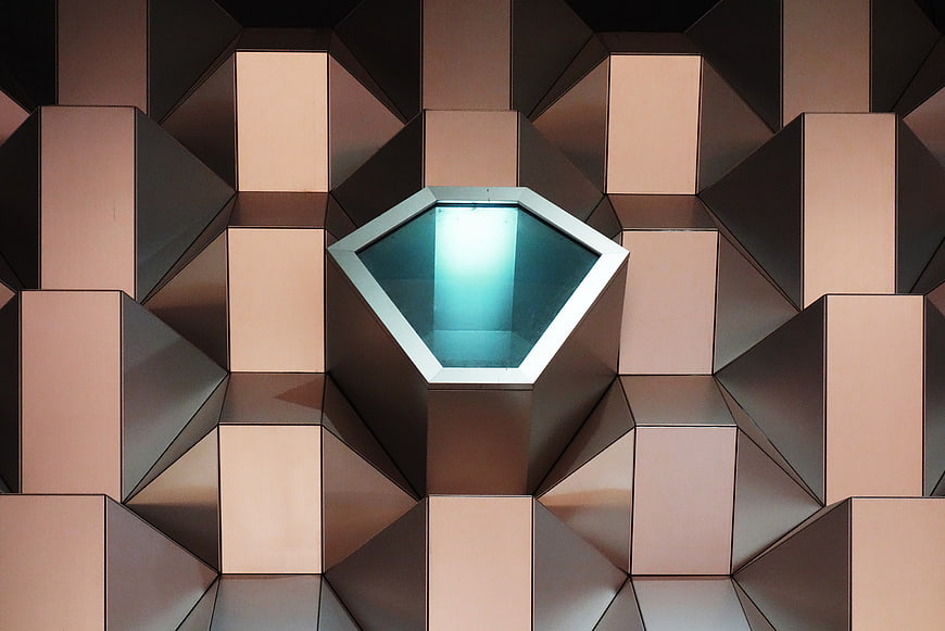 Modern geometric copper facade with hexagonal skylight