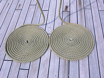 Two Coiled Ropes on Wooden Boat Deck