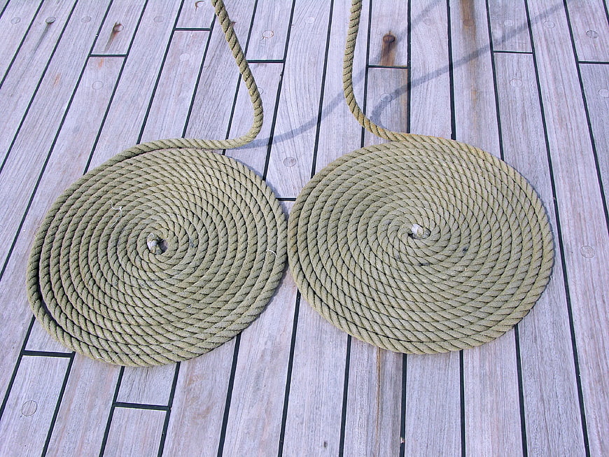 Two Coiled Ropes on Wooden Boat Deck