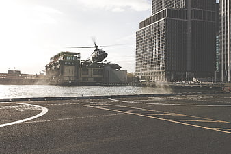 Helicopter Landing on Urban Waterfront Helipad