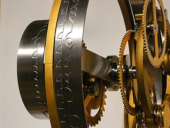 Close-up of intricate black and gold mechanical gears