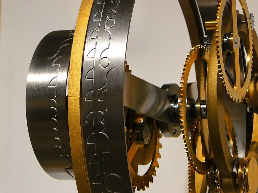 Close-up of intricate black and gold mechanical gears