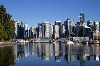 Vancouver Skyline Reflection in Harbor Water with Sailboats