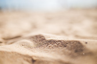Close-up of textured sand dunes with shallow depth of field