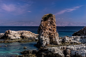 Dramatic coastal rock formation in turquoise Mediterranean sea