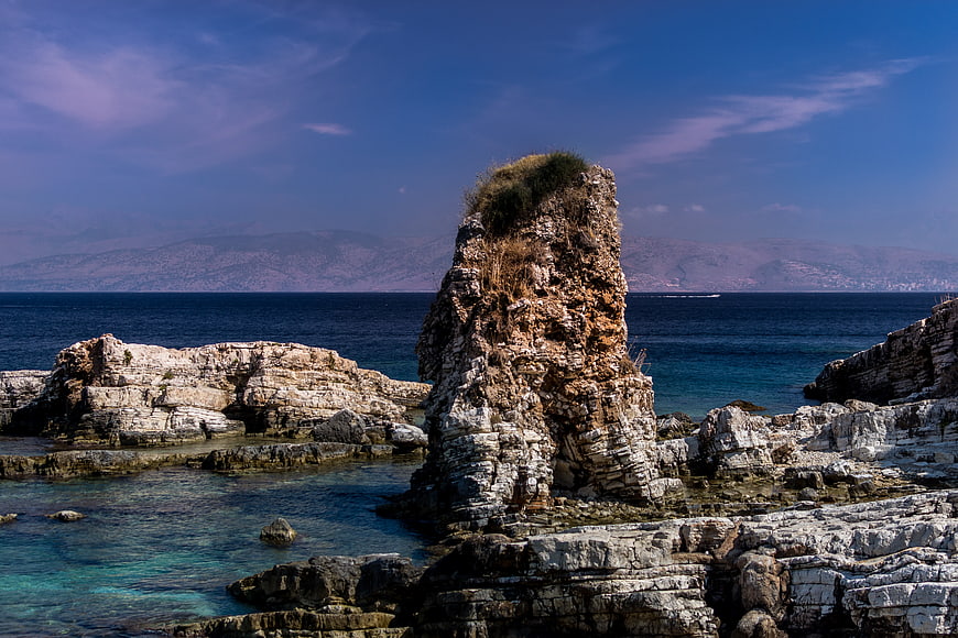 Dramatic coastal rock formation in turquoise Mediterranean sea