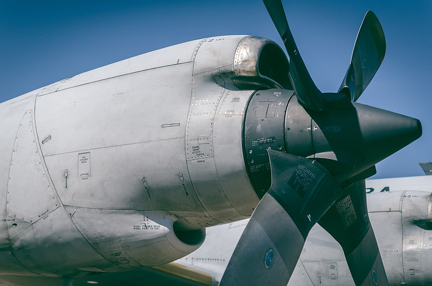 Close-up of vintage silver airplane engine and propeller