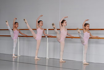 Young Girls Practicing Ballet at the Barre