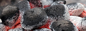 Close-up of glowing hot charcoal briquettes for barbecue