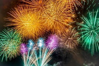 Colorful Fireworks Exploding in Night Sky