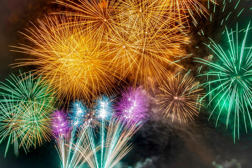 Colorful Fireworks Exploding in Night Sky