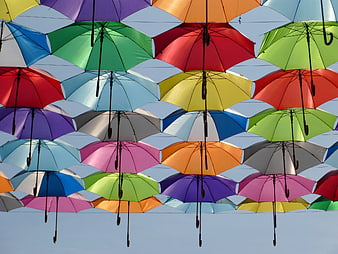 Colorful Hanging Umbrellas Against Blue Sky