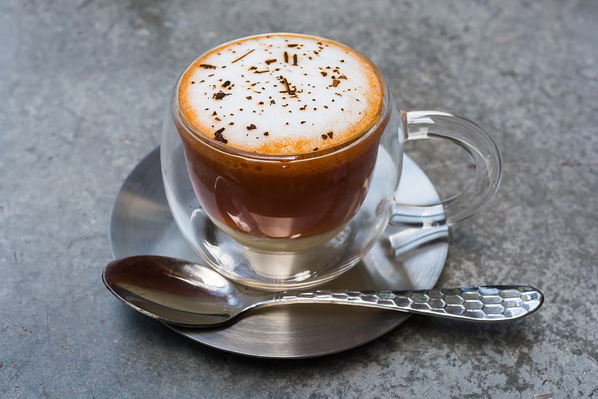 Hot Chocolate in Clear Glass Cup with Foam and Chocolate Shavings