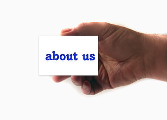 Hand holding white card with blue about us text