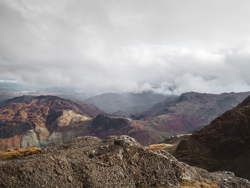 Dramatic Mountain Landscape with Clouds and Rocky Foreground